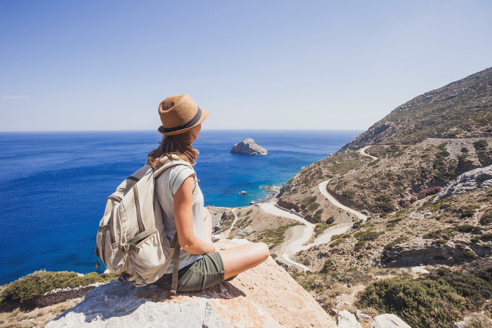 Young woman traveler enjoying nature, travel concept