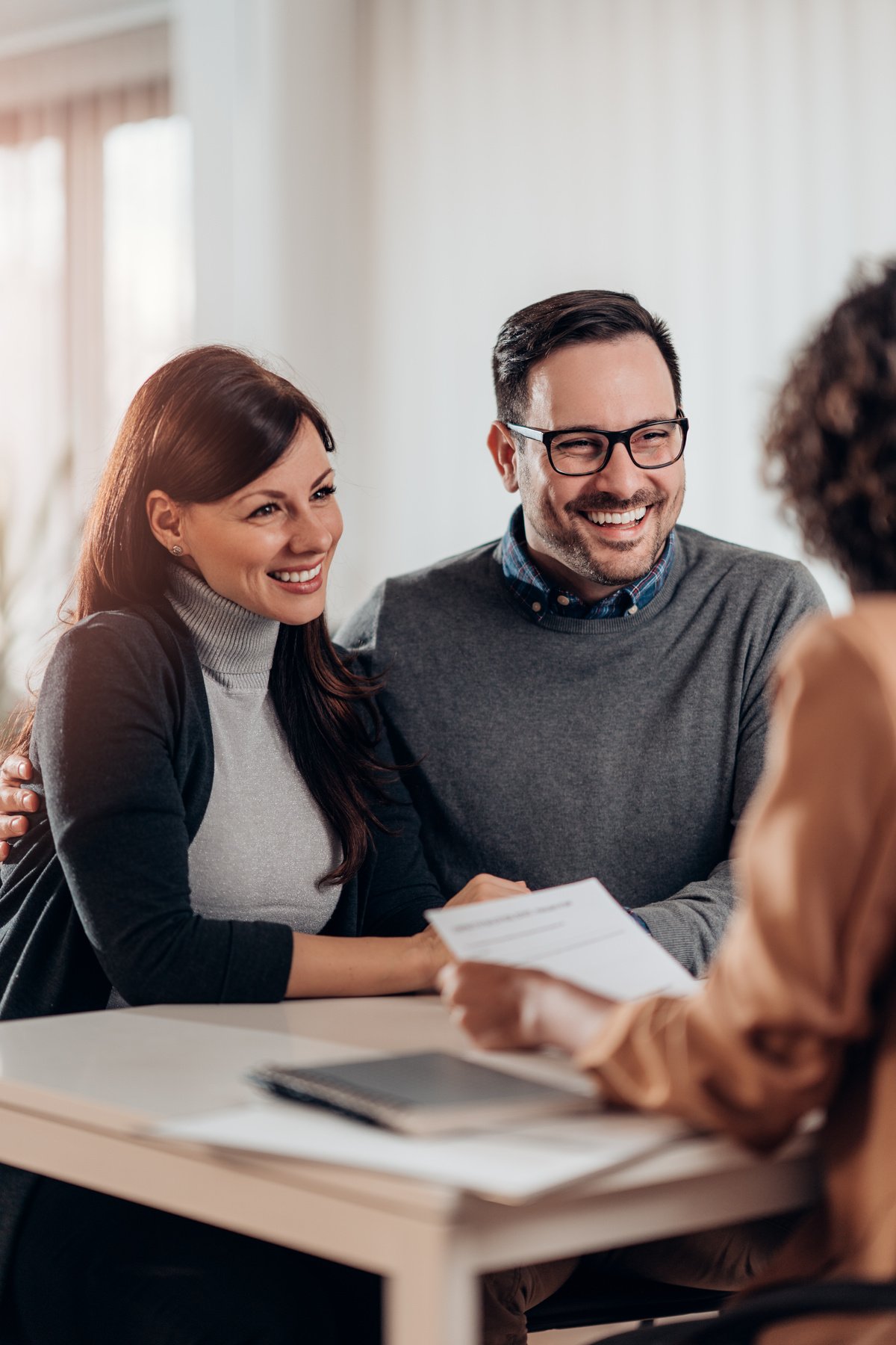 Travel agent talking with clients